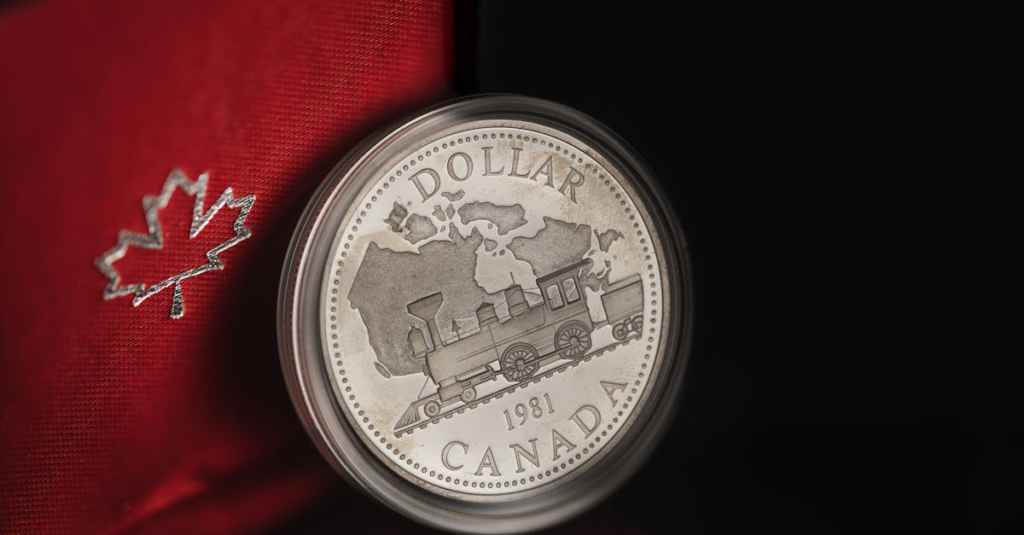 Detailed view of a 1981 Canadian silver dollar featuring a train design in an elegant case.